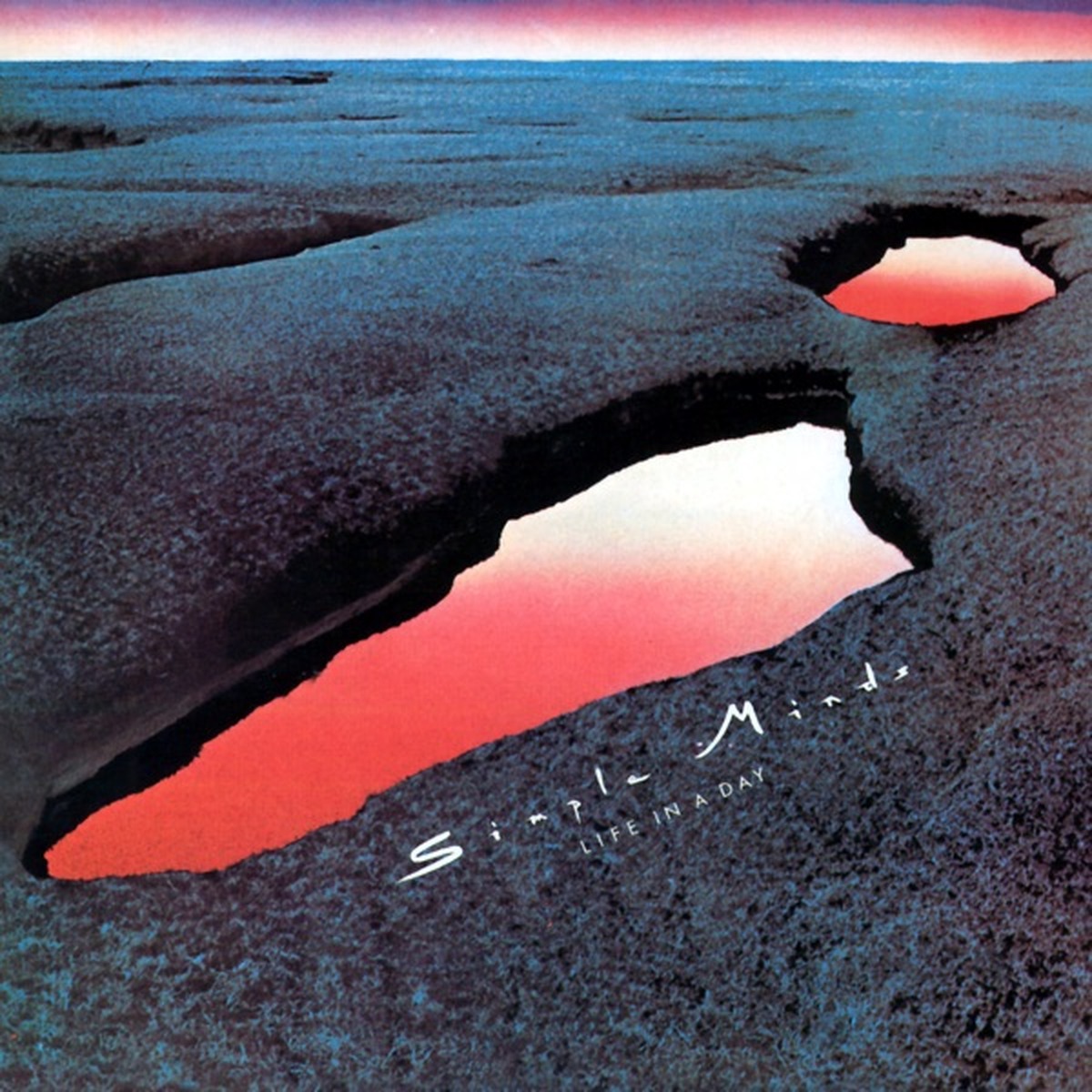 Life in a Day (album) by Simple Minds album cover