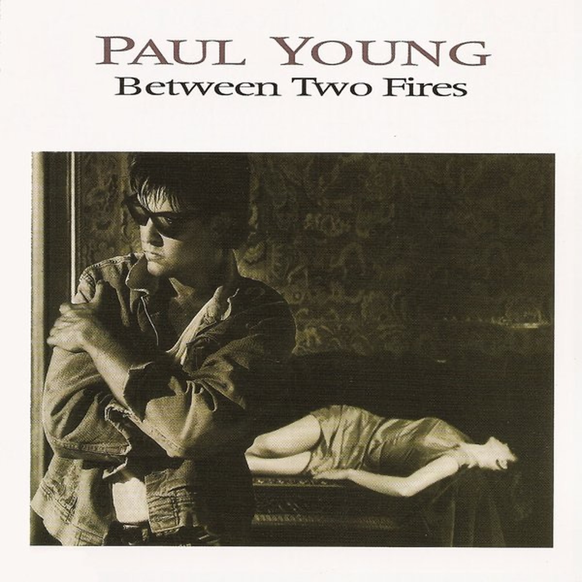 Between Two Fires by Paul Young album cover